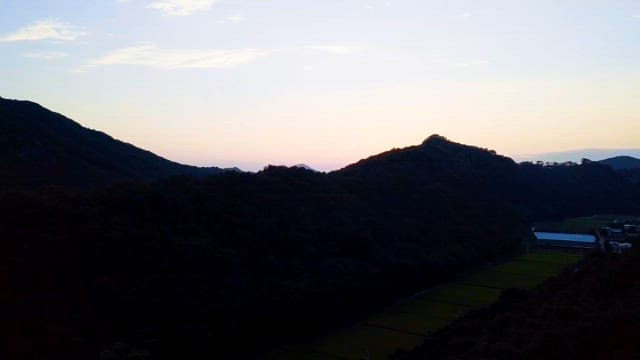 Serene Dawn over a Mountainous Landscape