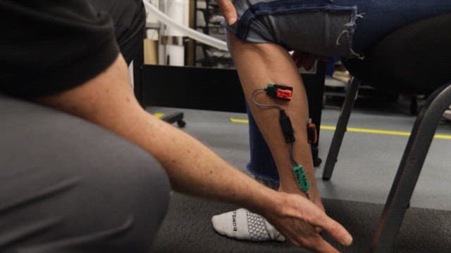 Legs of a person doing a soleus exercise