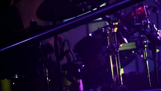 Drummer Passionately Hitting Drums for a Performance