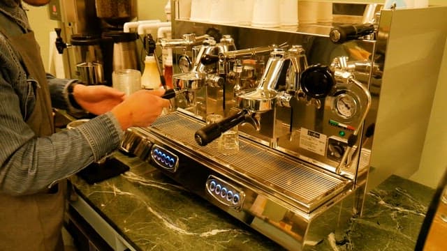 Barista Preparing Coffee on Espresso Machine