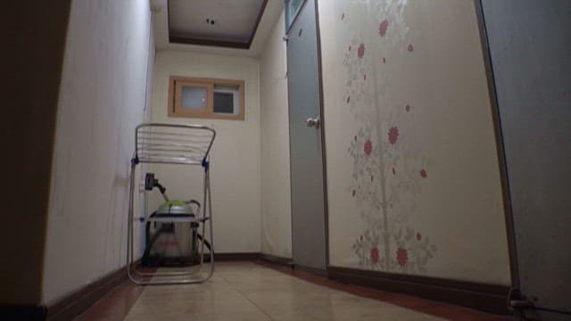 Quiet Corridor with Door and Drying Rack