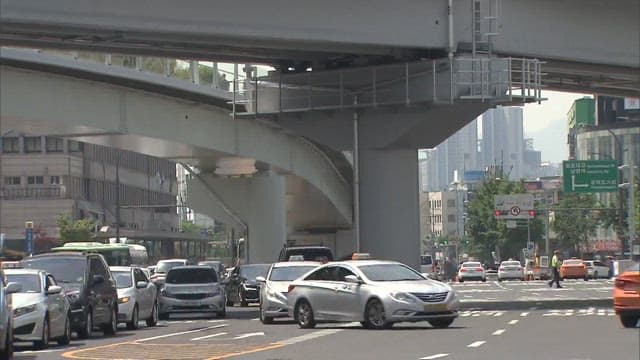 Busy City Traffic Under the Overpass