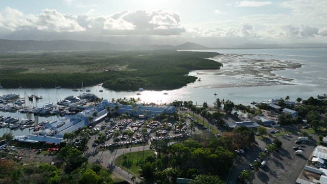 Marina with yachts and surrounding landscape on the sunny day