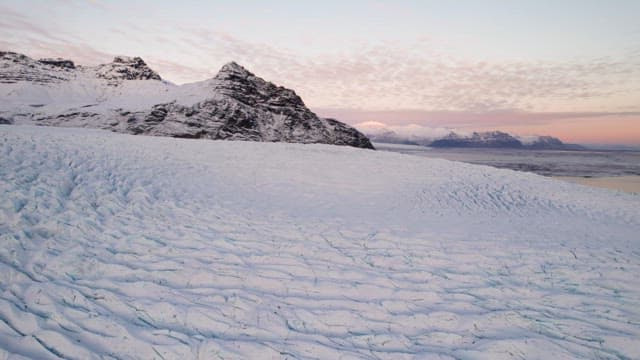 Vast glacier with snowy mountains