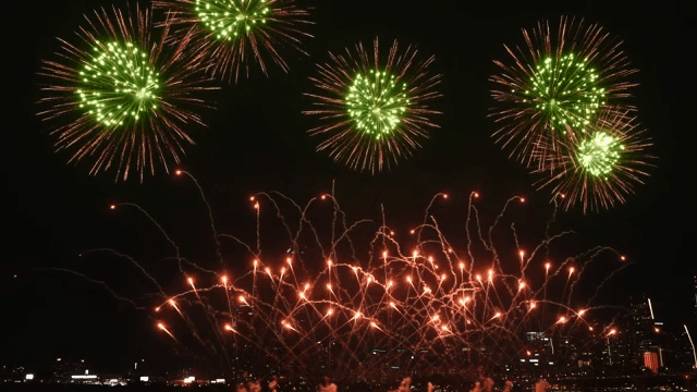 Fireworks display over a city skyline