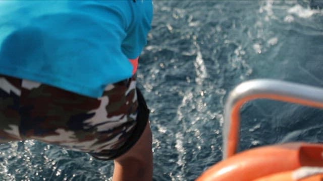Large sailfish being caught on a boat