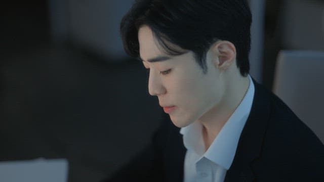 Man throwing work documents while working overtime