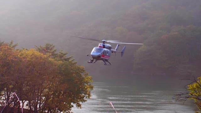 Air Ambulance Hovering Above Scenic Lake