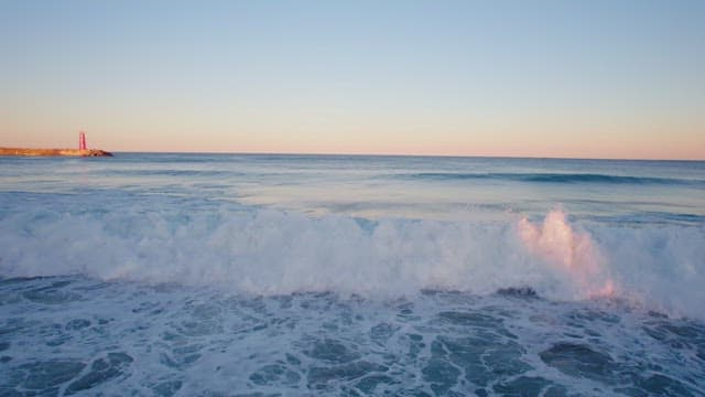 Waves crashing on a serene beach